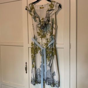 White ruffle dress with green/blue flowers